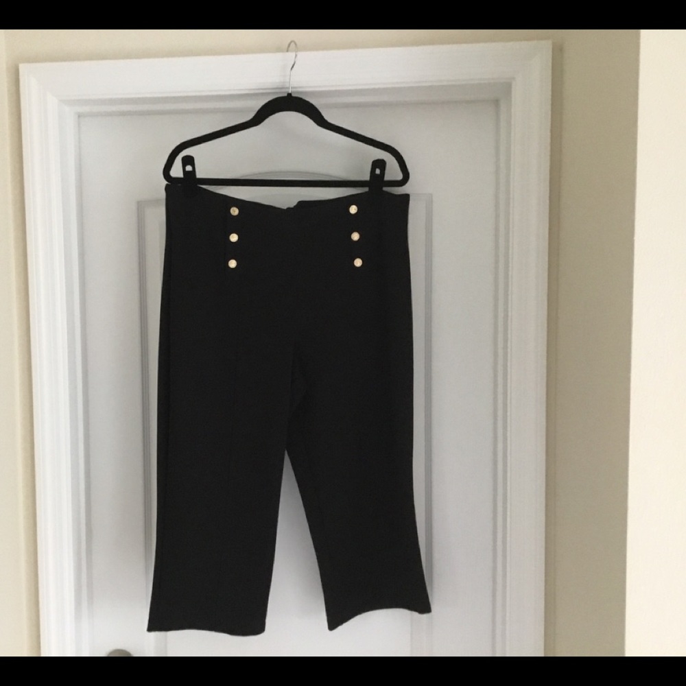 Capri pant with brass buttons.